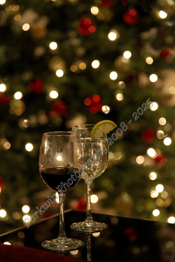 IMG 0302 
 half empty glasses of wine on table in front of Christmas tree 
 Keywords: wine glasses, Christmas tree