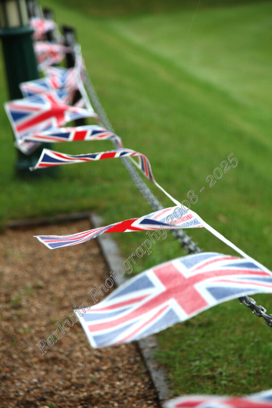 IMG 4713 
 Union Jack Bunting hanging from railings flying in the wind 
 Keywords: flags, Union Jack bunting