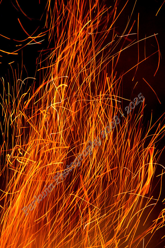 IMG 5569 
 Swirling sparks and flames rising from a fire on bonfire night. 
 Keywords: swirling sparks, flames, bonfire, night, abstract flames